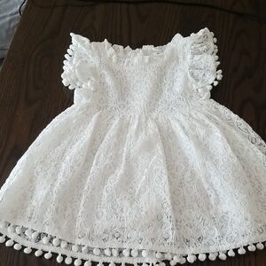 White Lace Baby Dress With Pompom Accents. Size EUR90